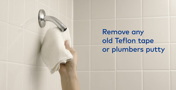 Remove old teflon tape or putty from shower pipe